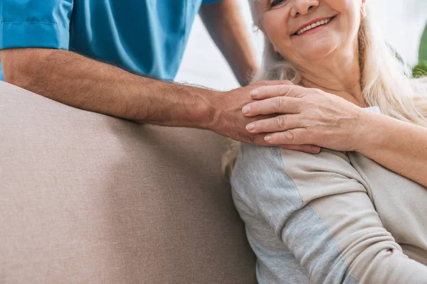 depositphotos_208491568-stock-photo-cropped-shot-smiling-senior-woman